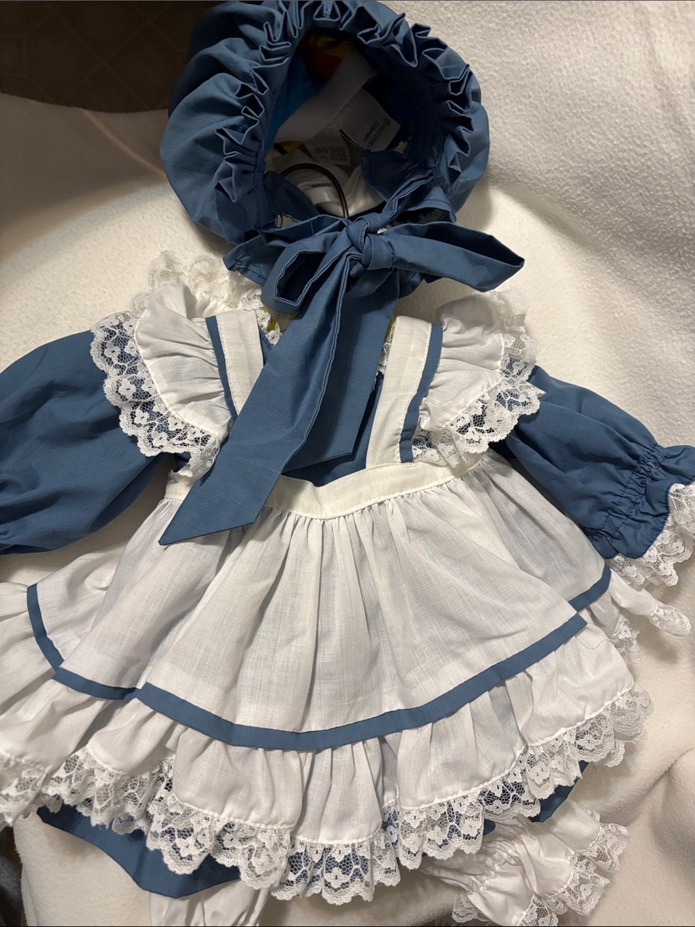 Vintage handmade light blue and white lace-trimmed Lolita-style doll dress